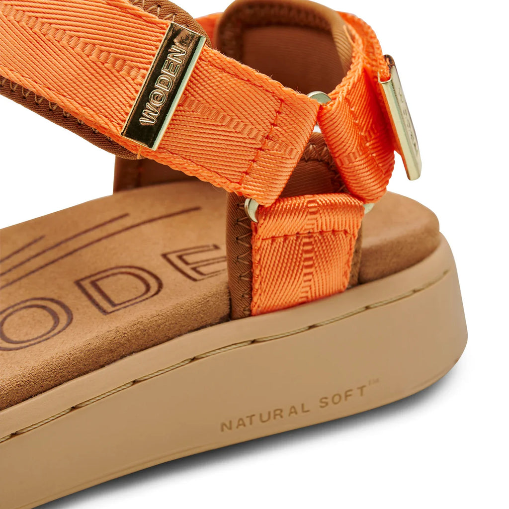 Woden Tiger orange sandals featuring adjustable straps and Natural Soft technology, perfect for beach and tropical vacation outfits.