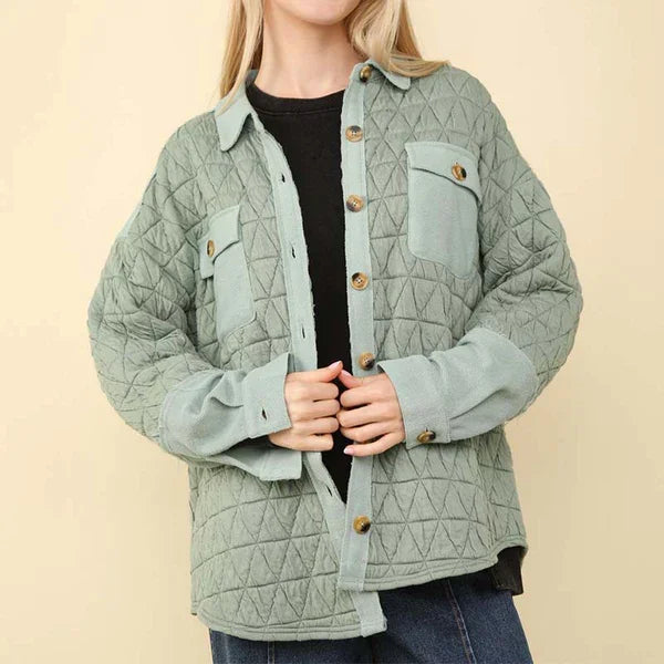 Cozy sage button-up quilted jacket from a Port Aransas boutique, perfect for curated women's fashion and stylish beach outfits.