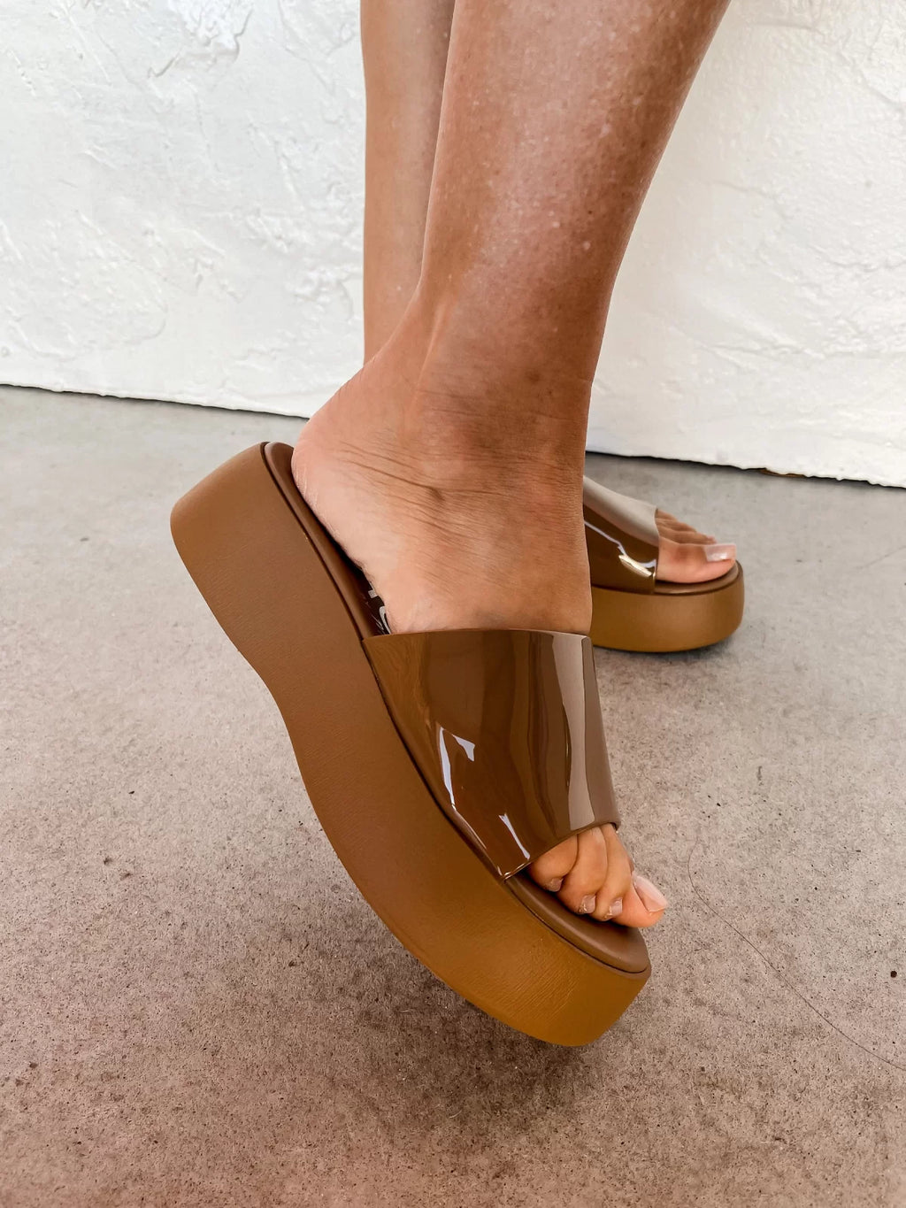 SOLAR TAN WEDGE SANDAL displayed with trendy coastal style at Raggdoll Boutique in Port Aransas.