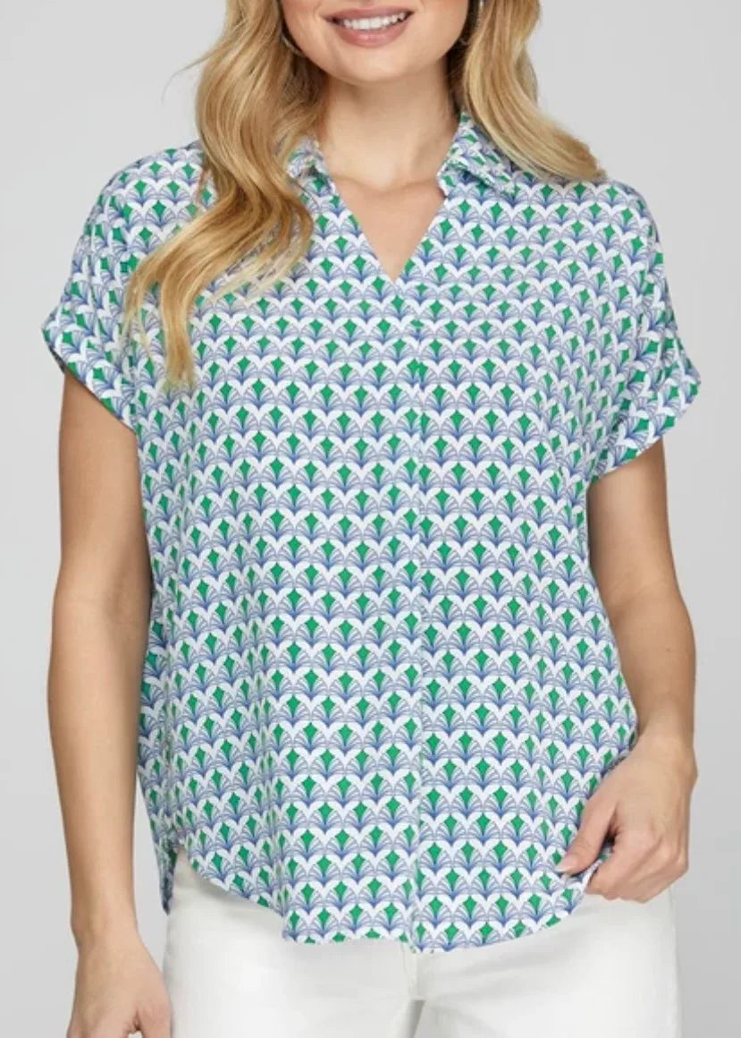 Vibrant green and blue top from a coastal boutique, featuring a relaxed fit, perfect for tropical vacations and casual styling.