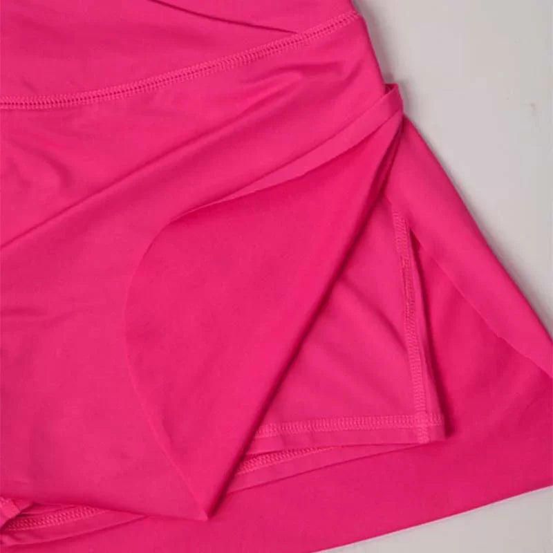 PINK CROSSOVER WAIST ACTIVE SKIRT w/SHORT LINER detail showing soft pink fabric at Raggdoll Boutique.