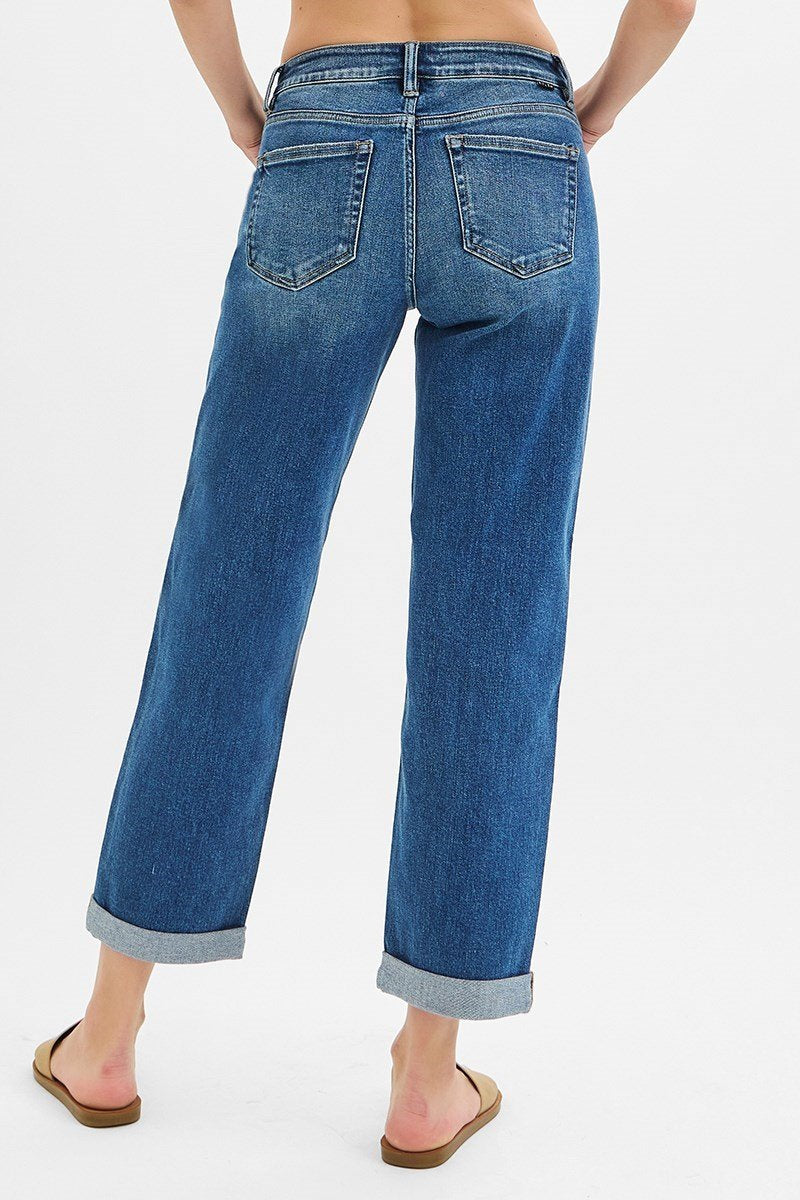 Mid rise boyfriend roll-up jeans in dark wash, perfect for coastal boutique clothing and casual beach outfits.