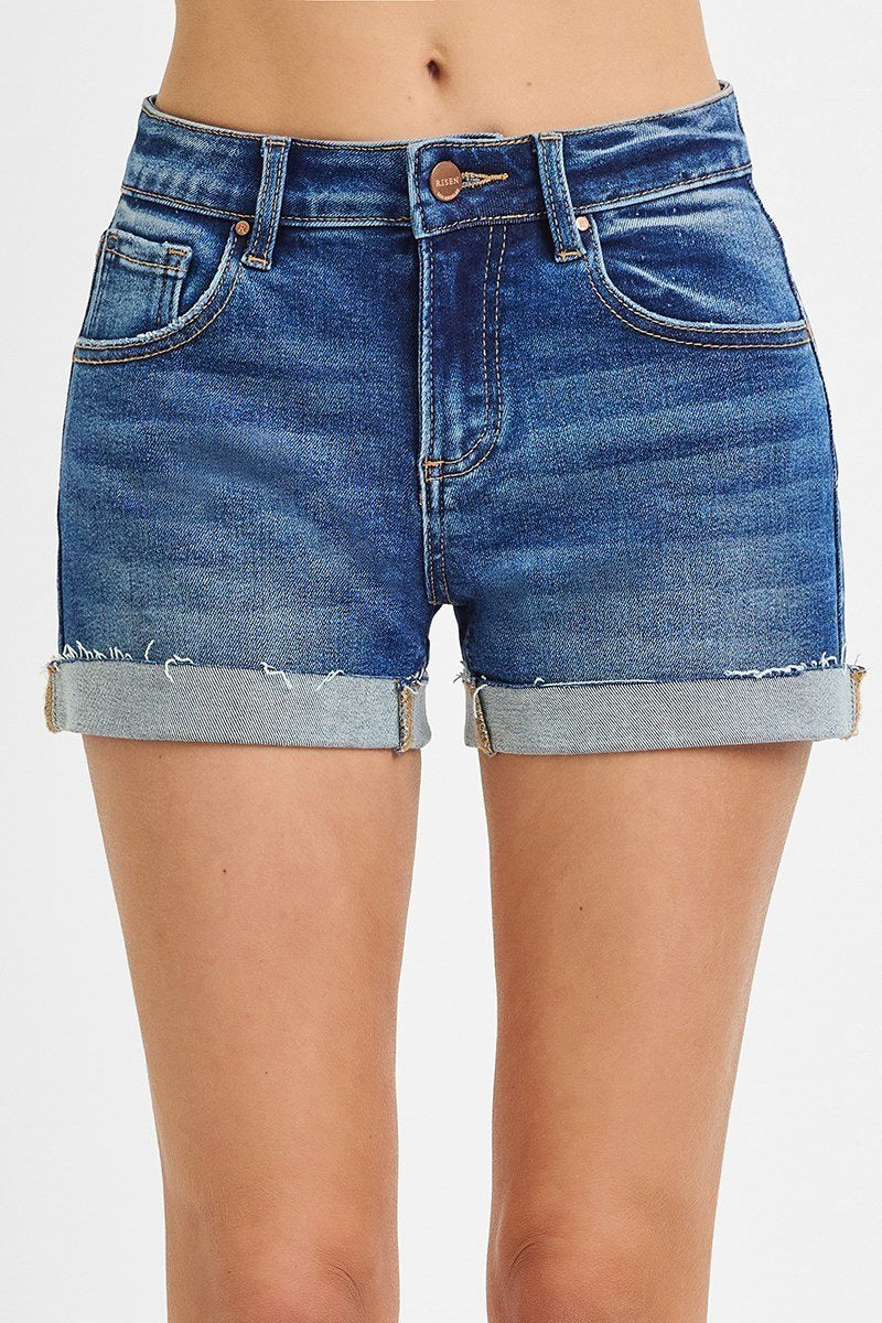 Dark denim low rise cuffed shorts for stylish summer outfits at a Port Aransas boutique, perfect for beach days and tropical vacations.