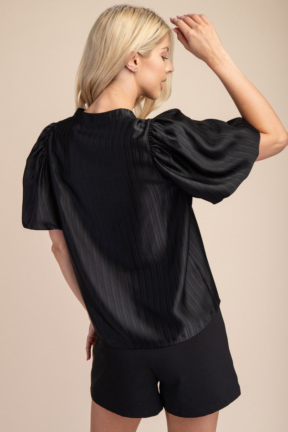 Stylish Black V-Neck Textured Satin Top, perfect for coastal boutique clothing and tropical vacation dresses.