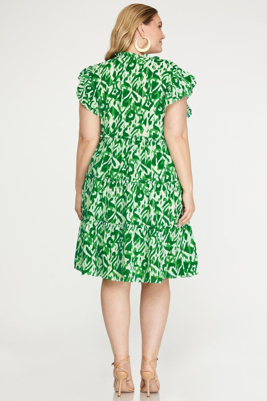 Plus green and white dress from a coastal boutique, perfect for tropical vacations and curvy women's fashion.