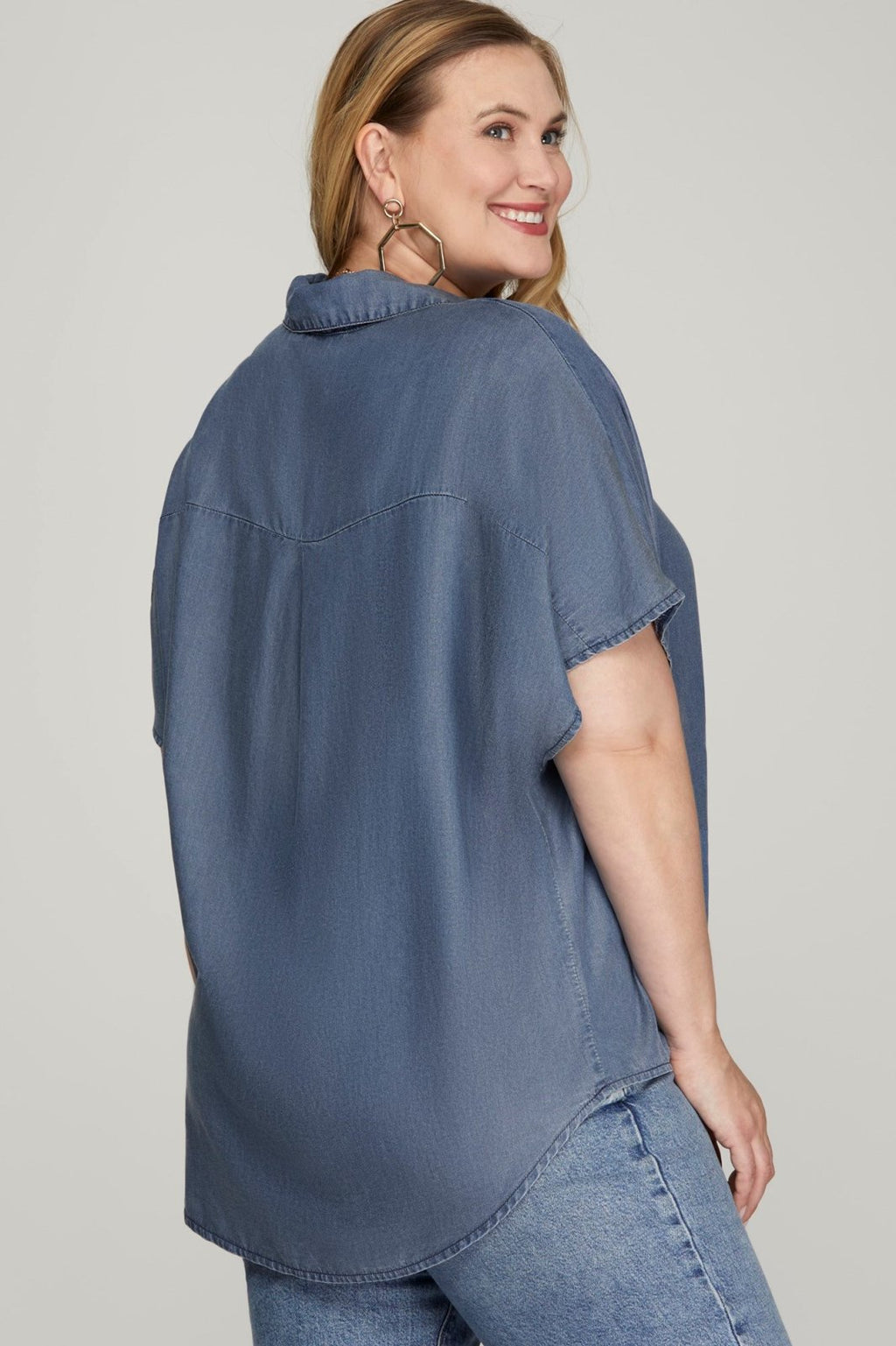 Washed denim plus size top showcasing relaxed fit, ideal for coastal boutique clothing and curvy women's fashion.