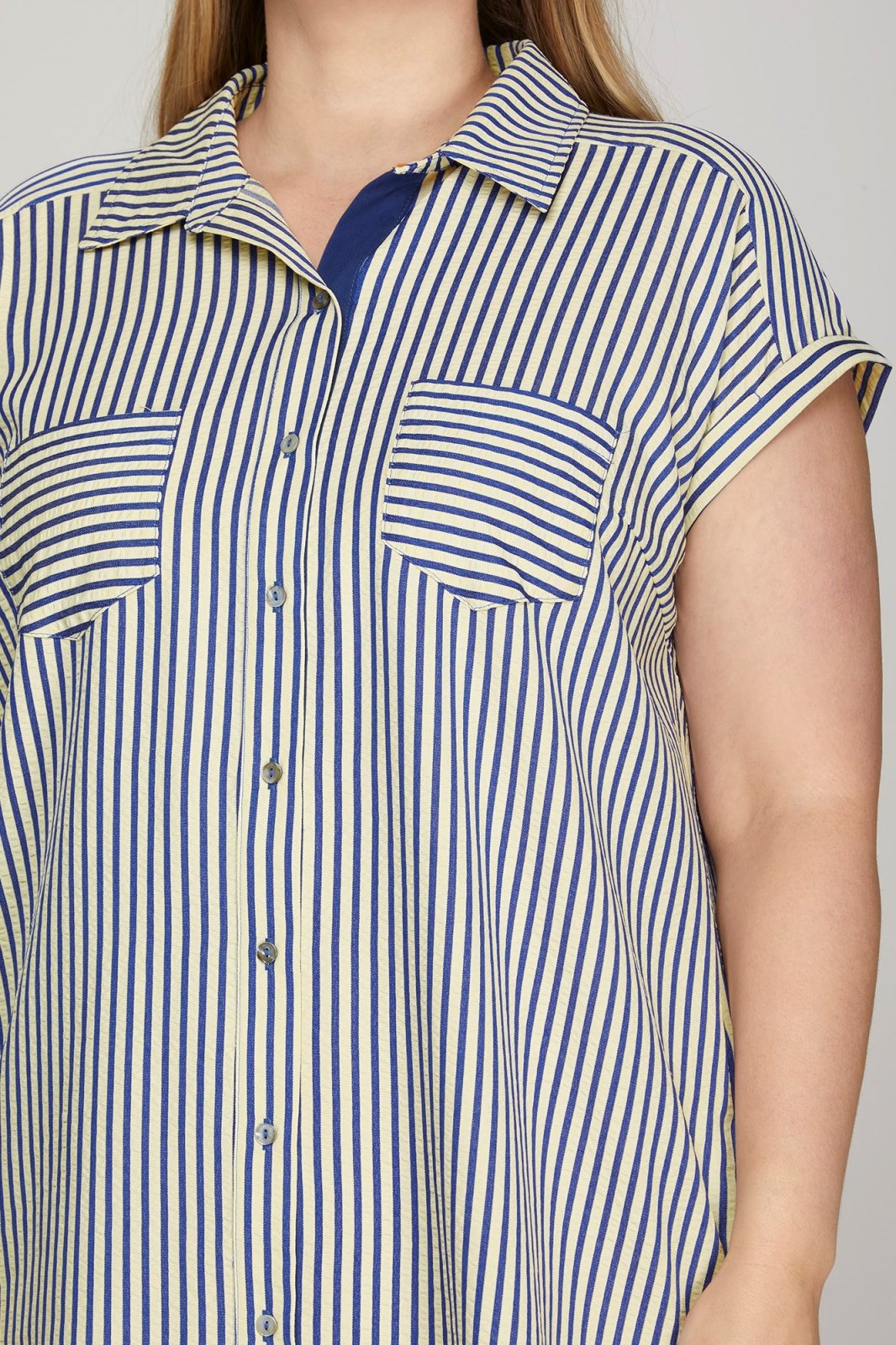 Navy striped dress featuring button-down front, short sleeves, and pockets, ideal for coastal boutique clothing and casual outings.