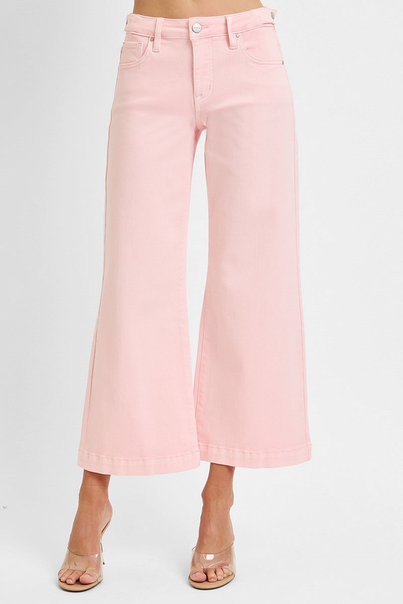 Risen soft pink jeans from a coastal boutique, stylish mid-rise crop perfect for casual or dressy looks.