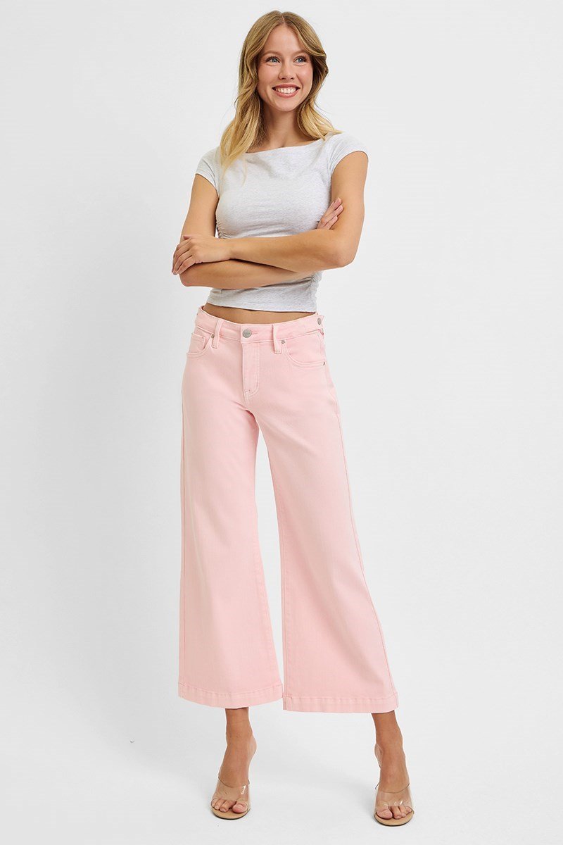 Risen soft pink jeans for women, perfect stylish bottoms from a coastal boutique, ideal for casual or dressy occasions.