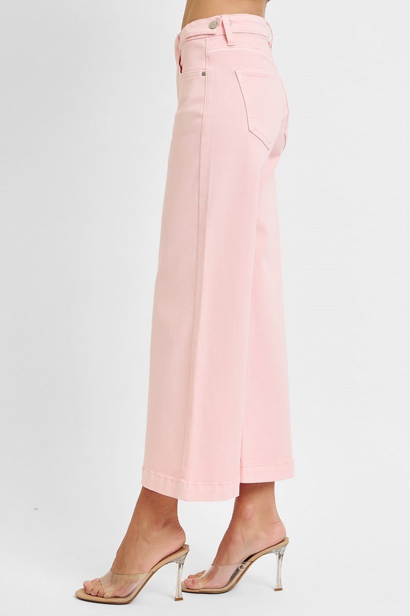 Risen soft pink jeans, mid-rise cropped style, perfect for casual and stylish outfits. Ideal for coastal boutique clothing.