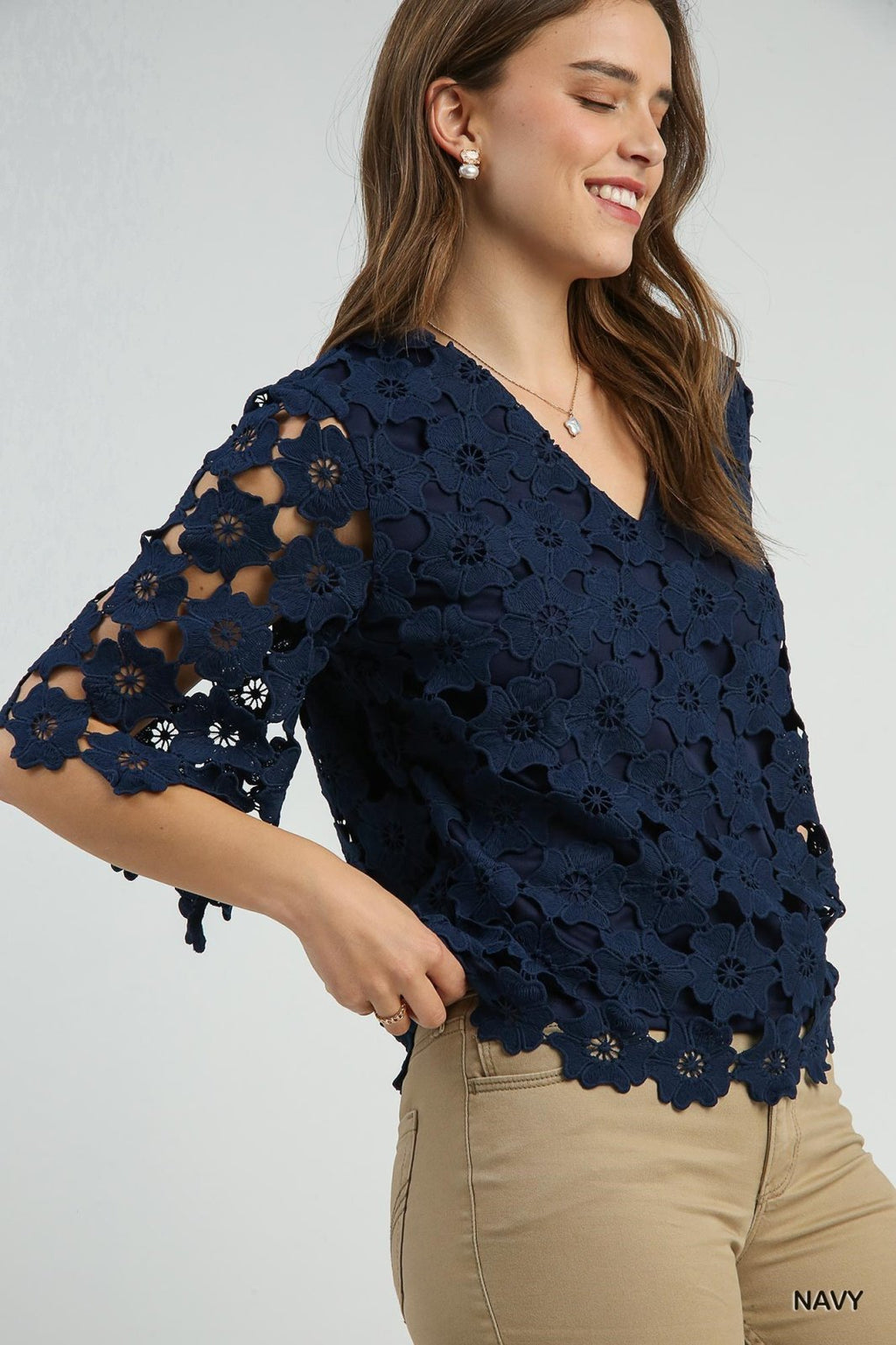 Woman modeling Scalloped Navy Floral Lace Top from Raggdoll Boutique, perfect for summer outfits Texas.
