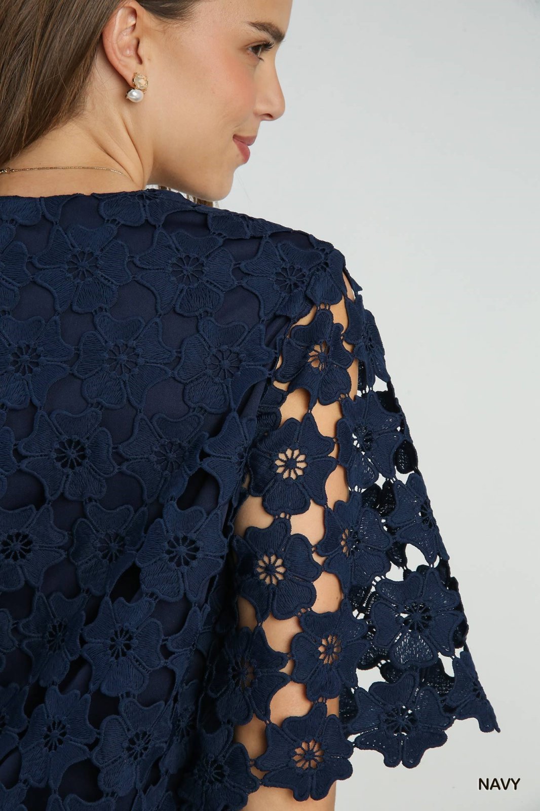 Scalloped Navy Floral Lace Top showcasing intricate floral lace details, perfect for trendy coastal style from Raggdoll Boutique.