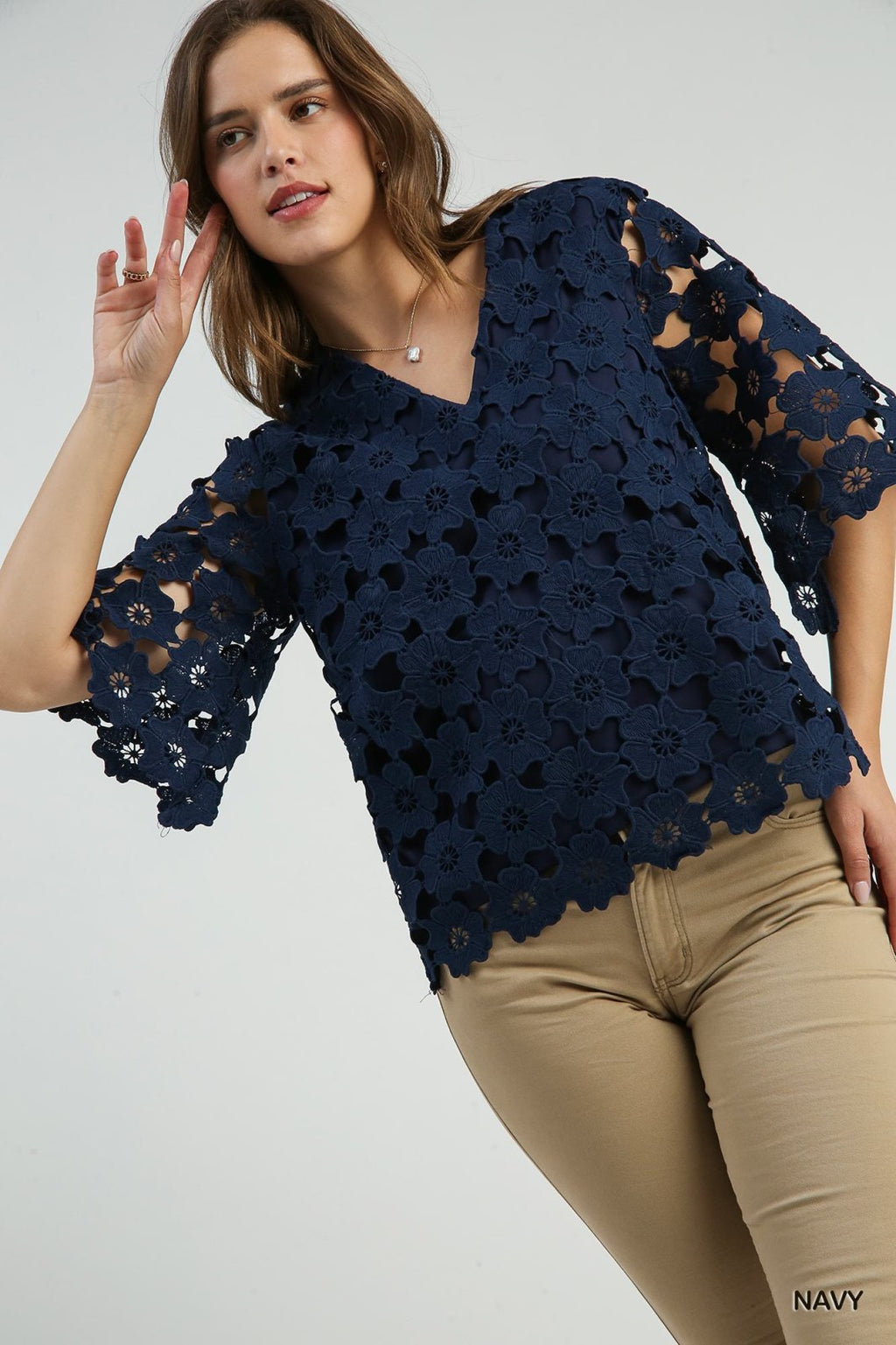 Model wearing a Scalloped Navy Floral Lace Top from Raggdoll Boutique, showcasing trendy coastal style.