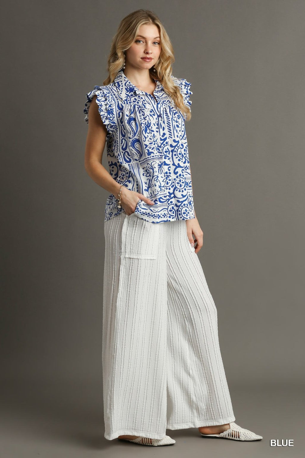 Royal and White Button Down Top from Raggdoll Boutique, perfect for trendy coastal style in Port Aransas.