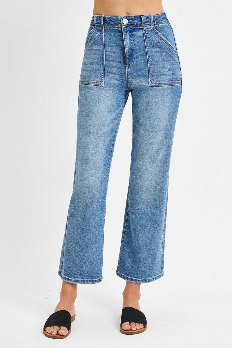 Medium denim wash ankle flare pants with patch pockets, perfect for curvy plus size fashion at a coastal boutique clothing.