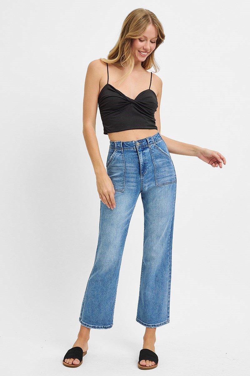 Medium denim wash ankle flare pants styled with a black crop top, perfect for curvy plus size fashion and coastal boutique clothing.