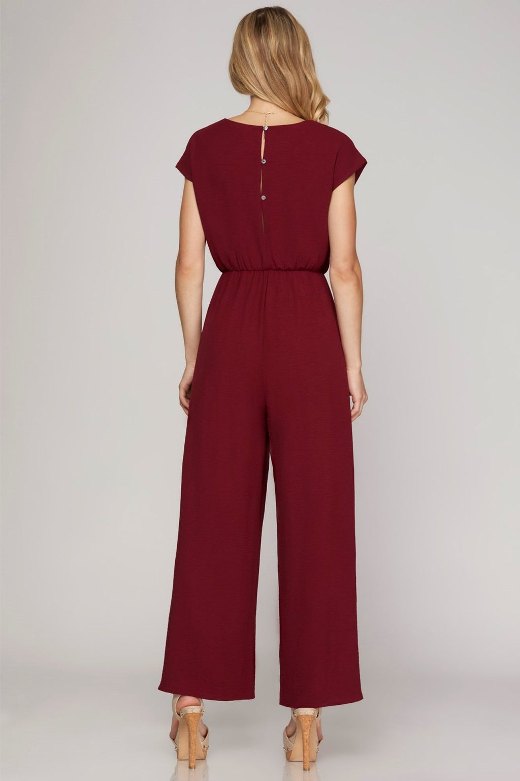 Stylish wine jumpsuit, 100% polyester, perfect for coastal boutique clothing and curvy plus size fashion.