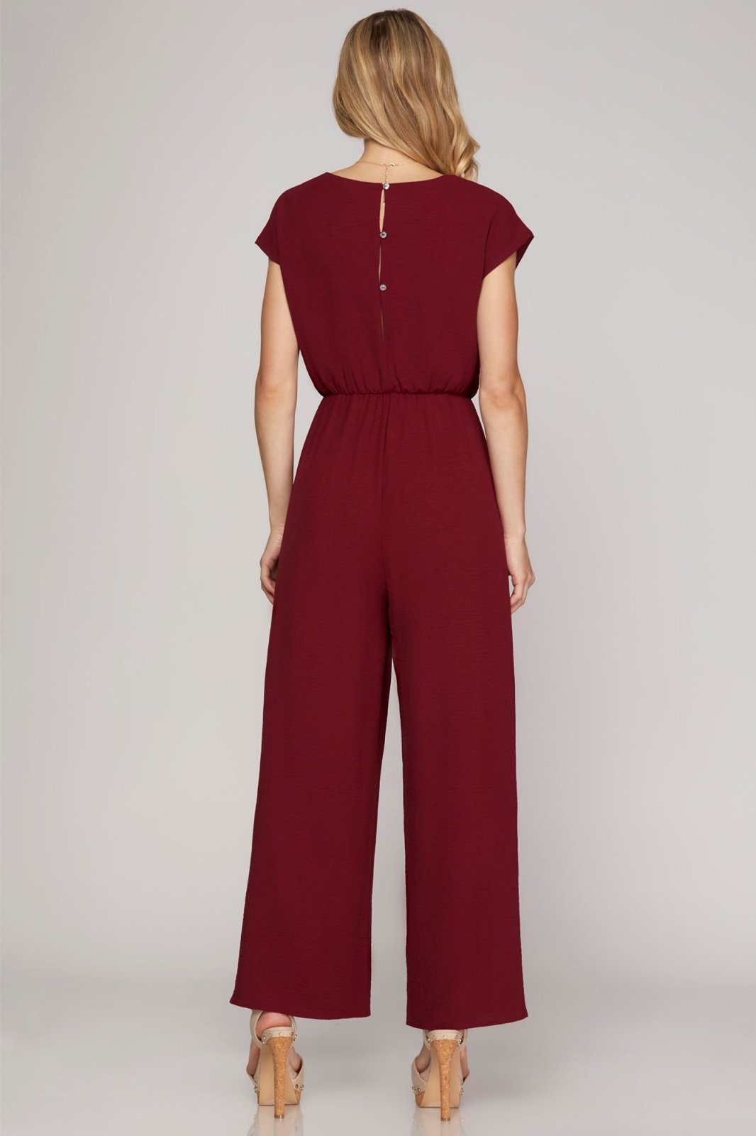 Stylish wine jumpsuit, 100% polyester, perfect for coastal boutique clothing and curvy plus size fashion.