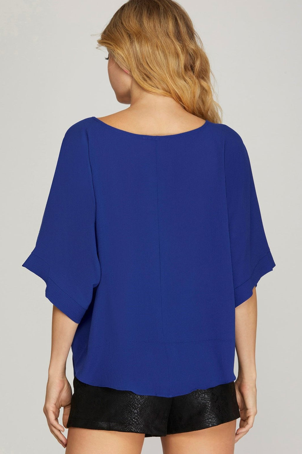 ROYAL BLUE SIDE-TIE TOP shown from the back, featuring loose sleeves perfect for summer outfits Texas.
