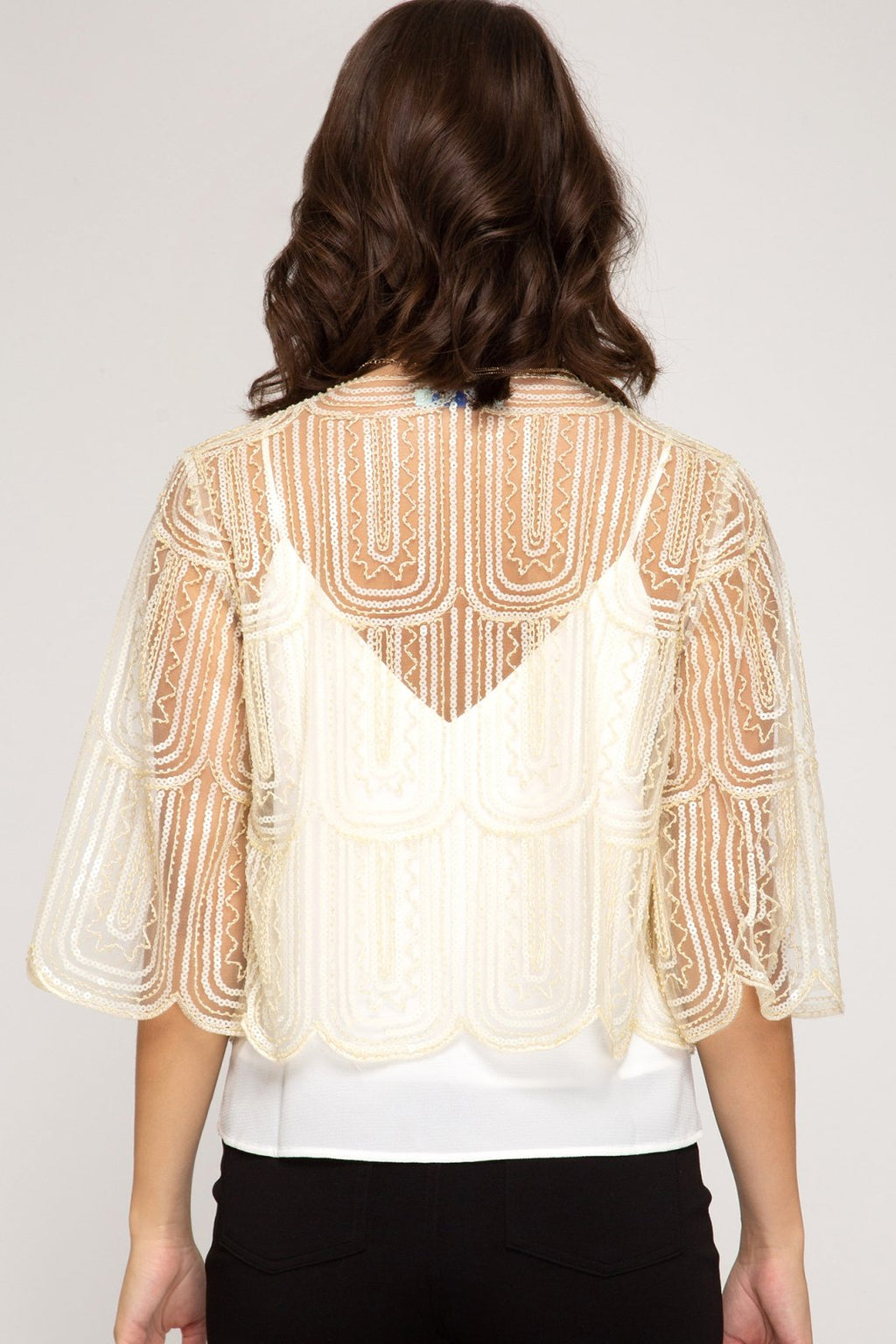Cream sequin bolero cardigan showcasing a stylish back design, perfect for coastal boutique clothing and tropical vacation dresses.