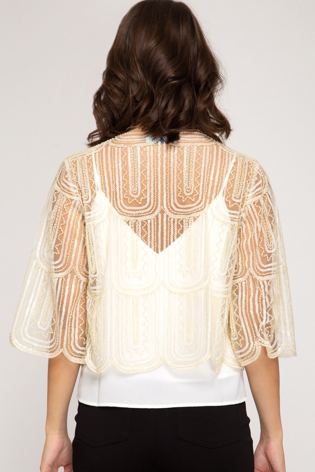 Cream sequin bolero cardigan showcasing a stylish back design, perfect for coastal boutique clothing and tropical vacation dresses.