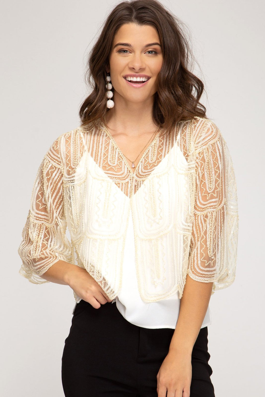 Cream sequin bolero cardigan perfect for coastal boutique clothing, paired with stylish tops for women and beach dresses.