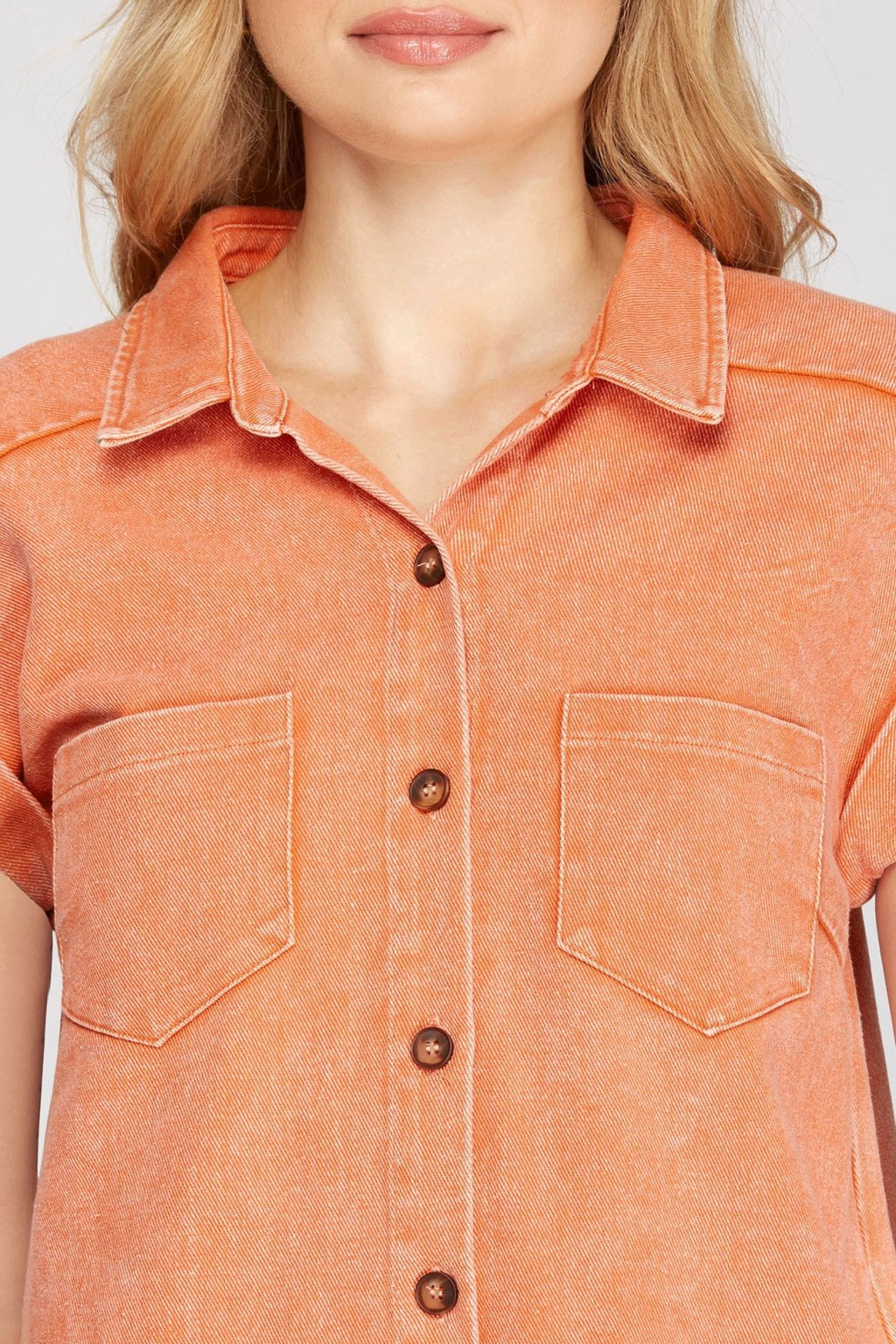 Model wearing the KEEP IT COOL DRESS in orange from Raggdoll Boutique, showcasing trendy coastal style.