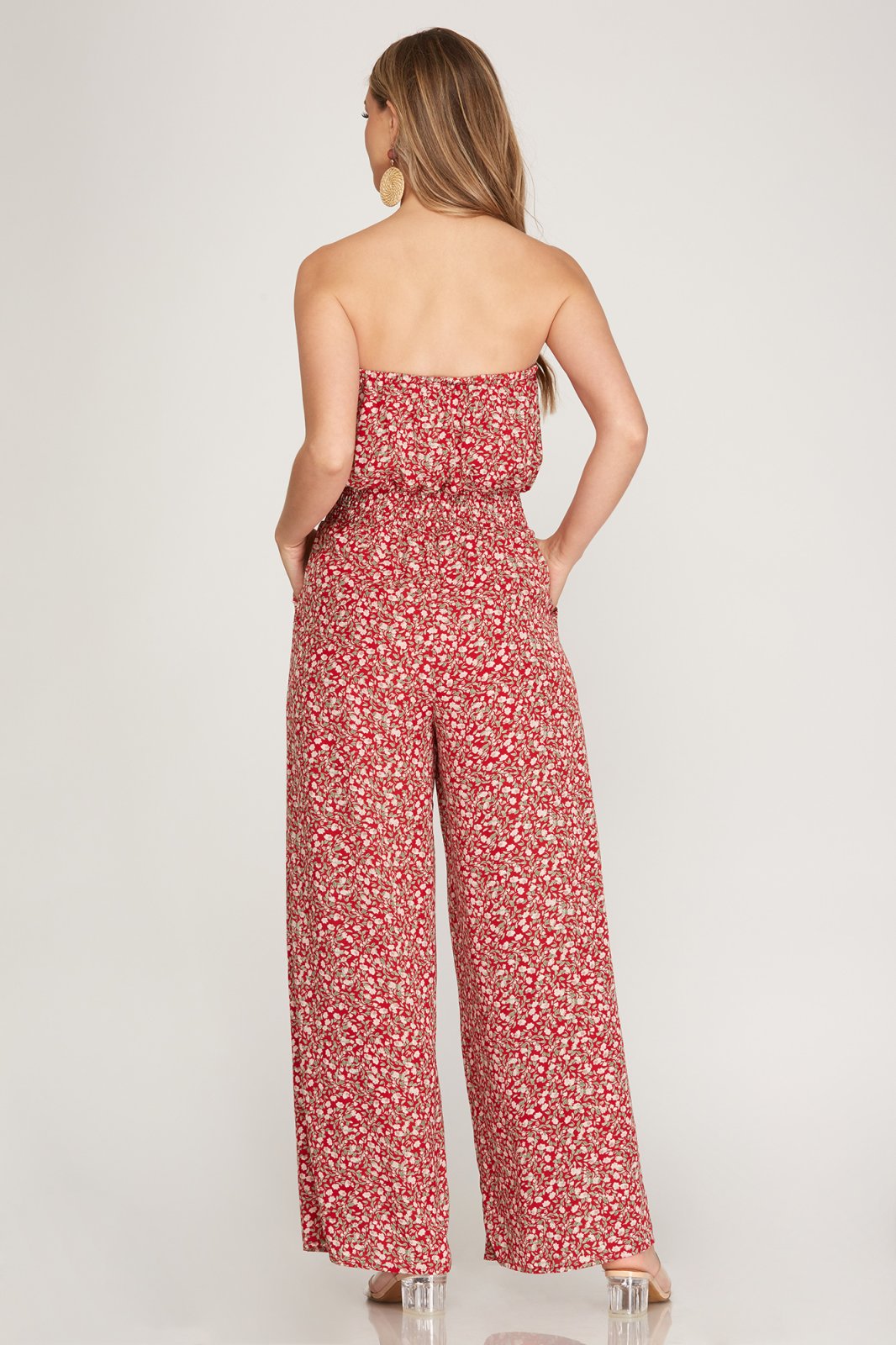 Back view of a RED FLORAL STRAPLESS JUMPSUIT from Raggdoll Boutique, perfect for summer outfits Texas.