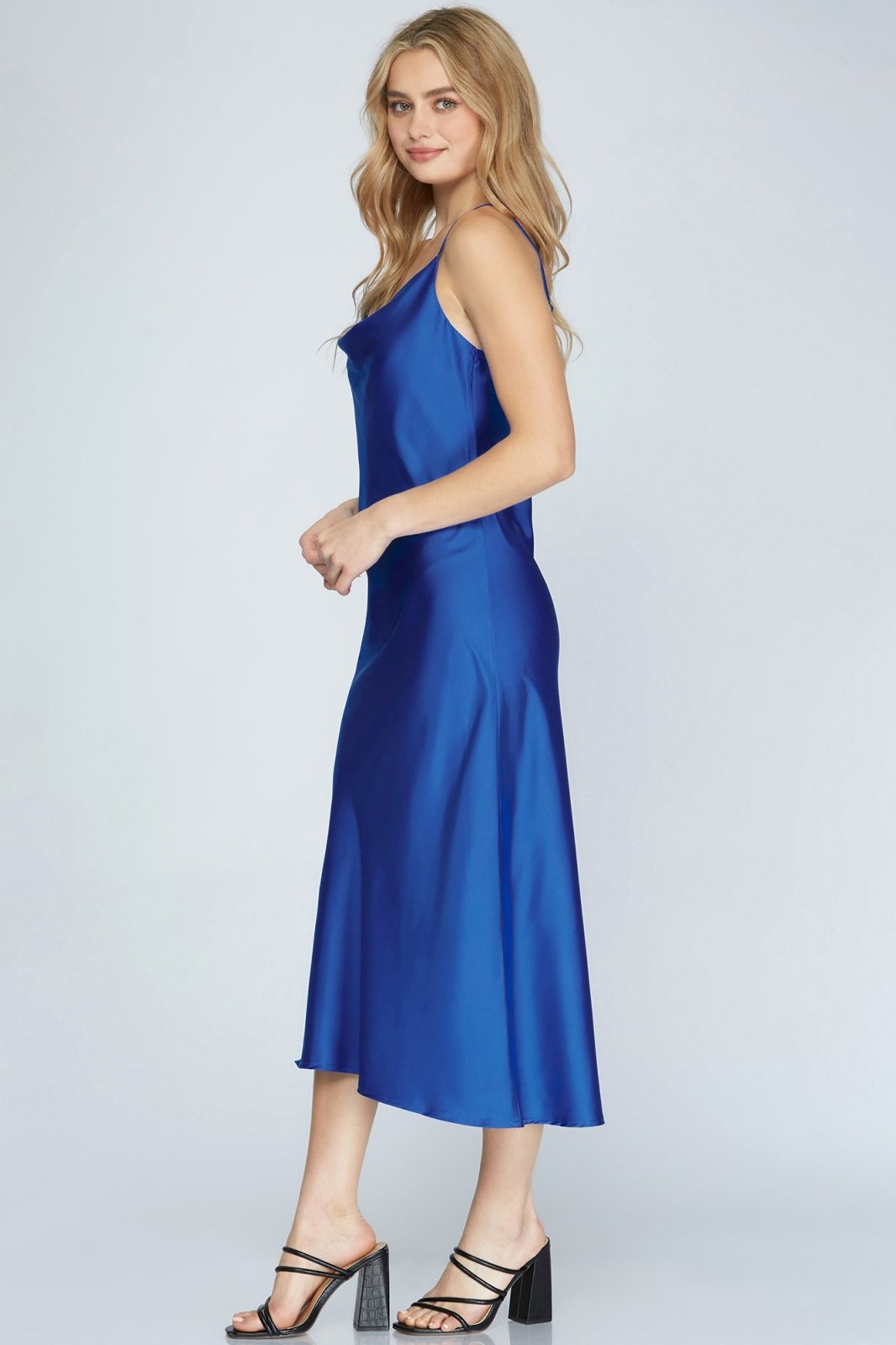 Side view of a model in the ROYAL BLUE DIVA MAXI dress from Raggdoll Boutique, showcasing trendy coastal style.