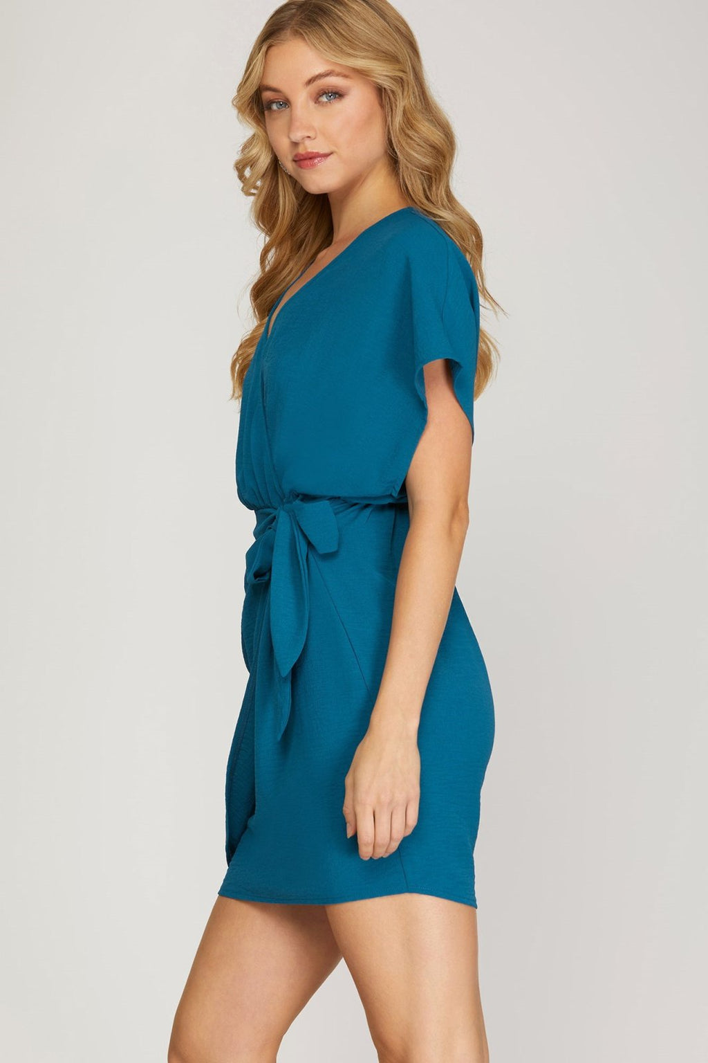 Model wearing a teal dress, TEAL ME I'M PRETTY DRESS from Raggdoll Boutique, perfect for summer outfits Texas.