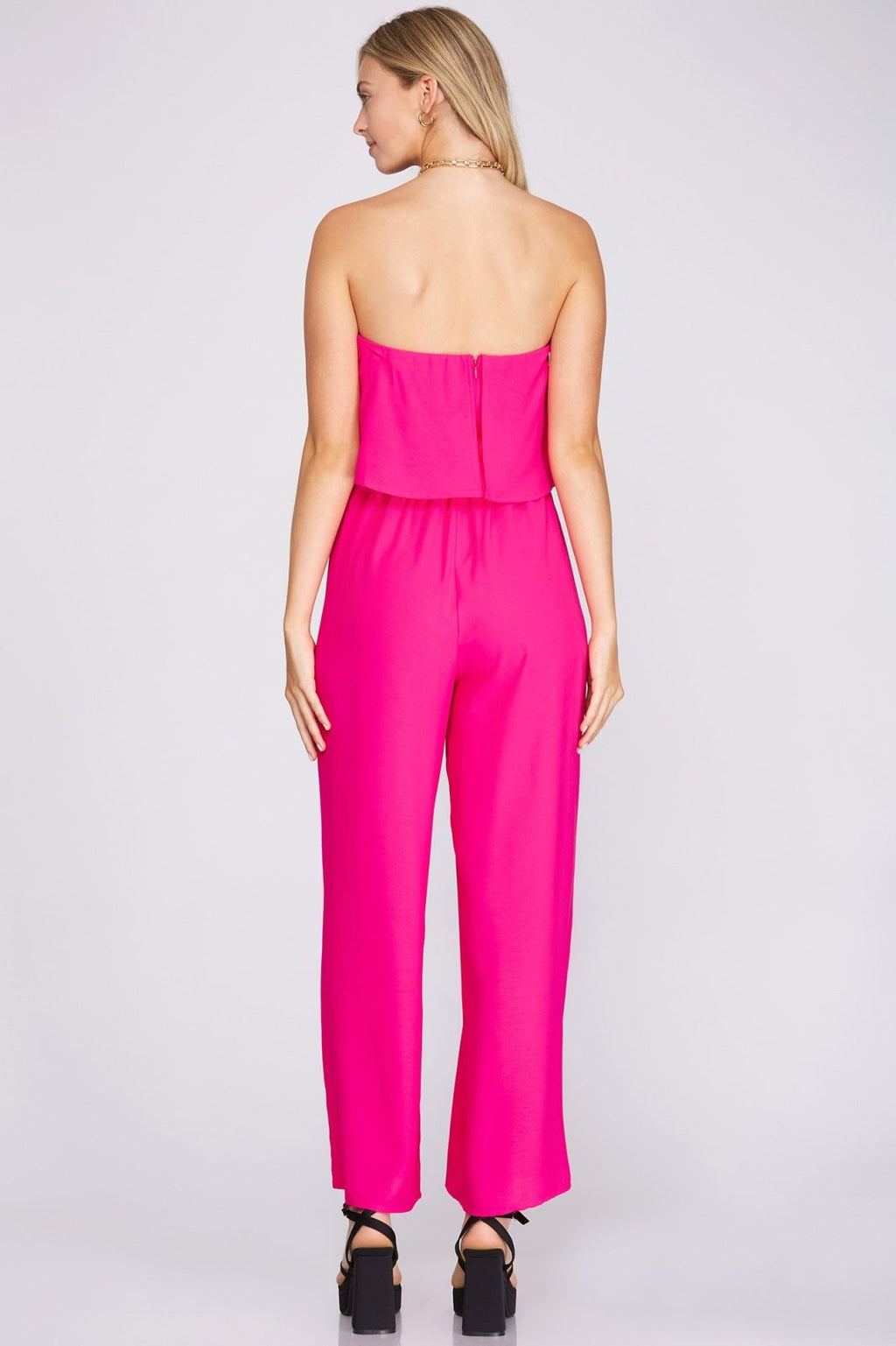 Back view of the FUSHIA JUMPSUIT, perfect for trendy coastal style from Raggdoll Boutique in Port Aransas.