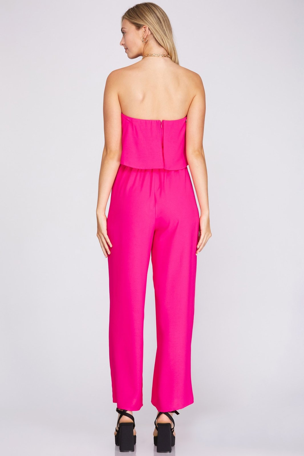 Back view of the FUSHIA JUMPSUIT, perfect for trendy coastal style from Raggdoll Boutique in Port Aransas.