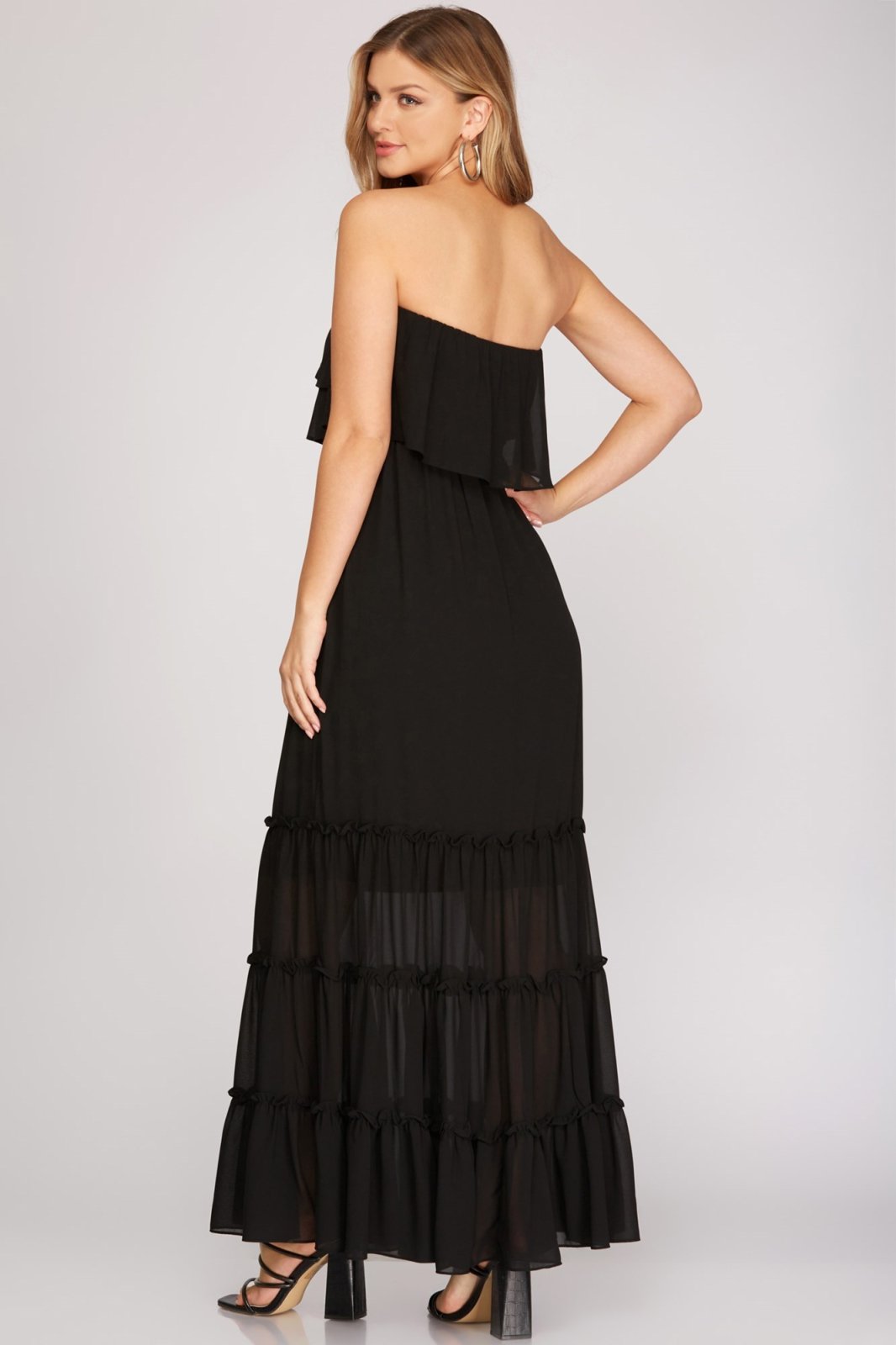 Stylish black DAY OR NIGHT maxi dress from a coastal boutique, perfect for tropical vacations and curated women's fashion.