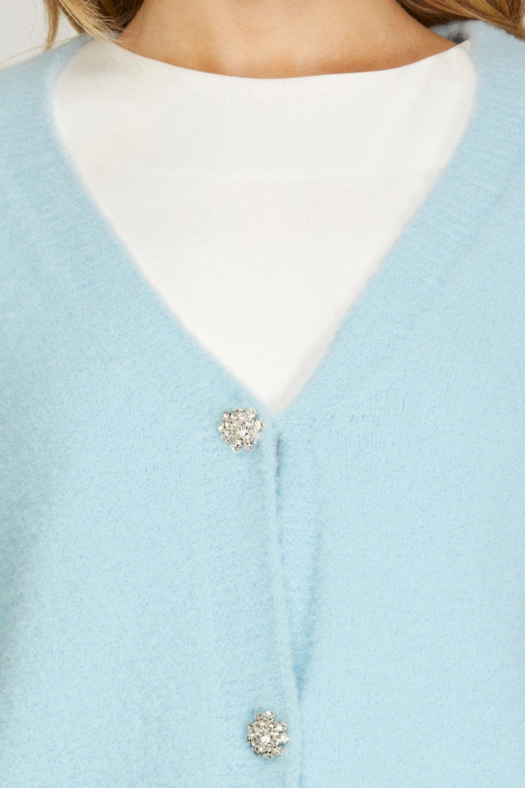 LT BLUE LONG SLEEVE FUZZY SWEATER CARDIGAN W/JEWEL BUTTONS styled with a white top from Raggdoll Boutique.