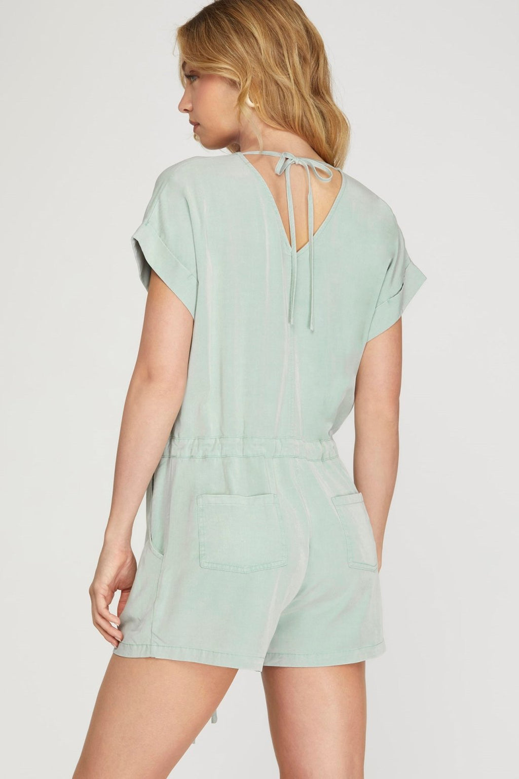 Chic seafoam tie-back romper, perfect for casual days or beach outings. A stylish addition to coastal boutique clothing.