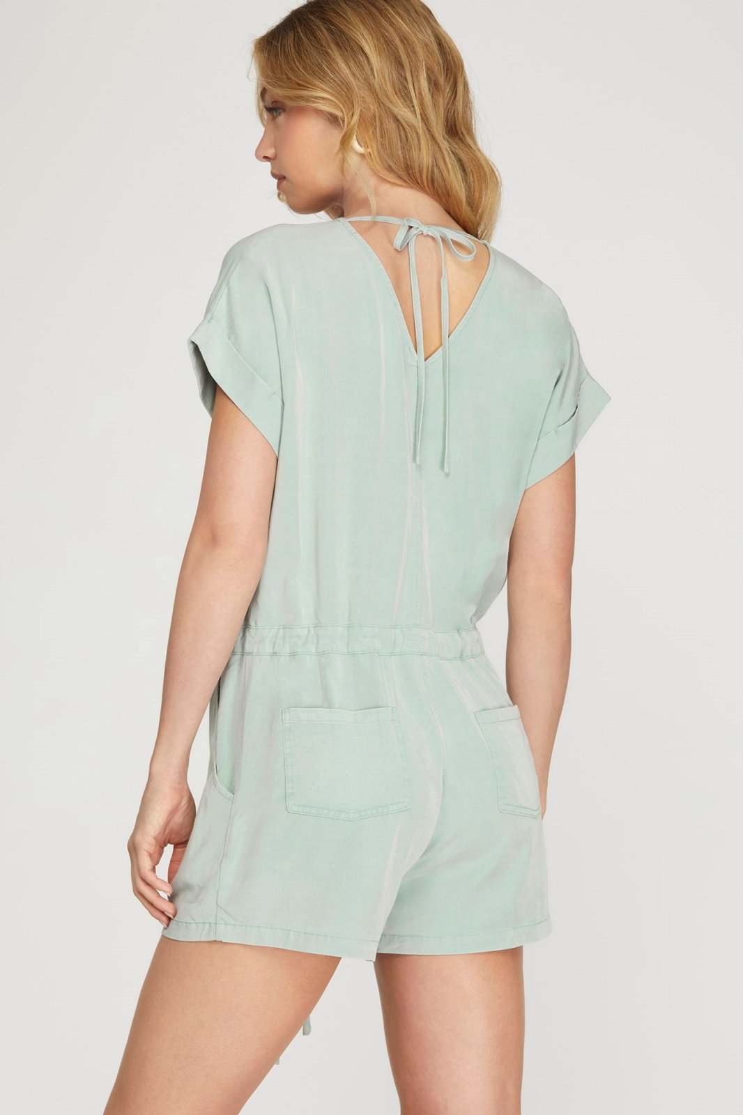 Chic seafoam tie-back romper, perfect for casual days or beach outings. A stylish addition to coastal boutique clothing.