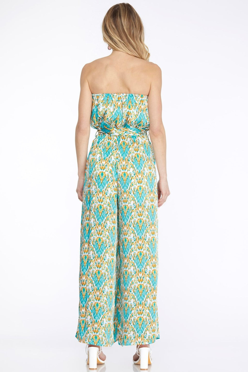 Back view of Aqua and Yellow Print Strapless Jumpsuit with waist tie, featuring a vibrant coastal pattern.