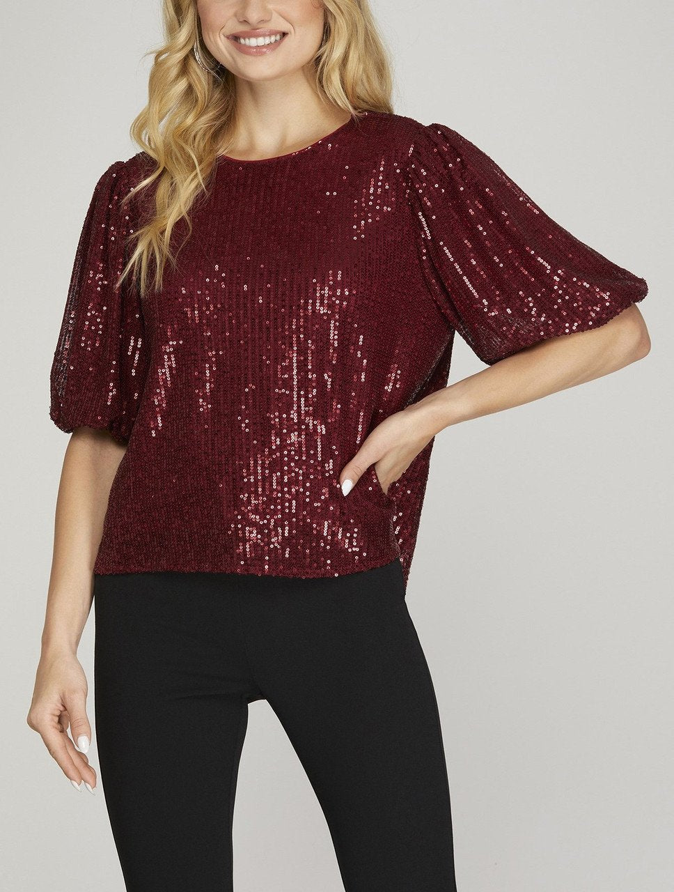 Stylish red sequin top with half puff sleeves, perfect for Port Aransas boutique, ideal for beach and tropical vacations.