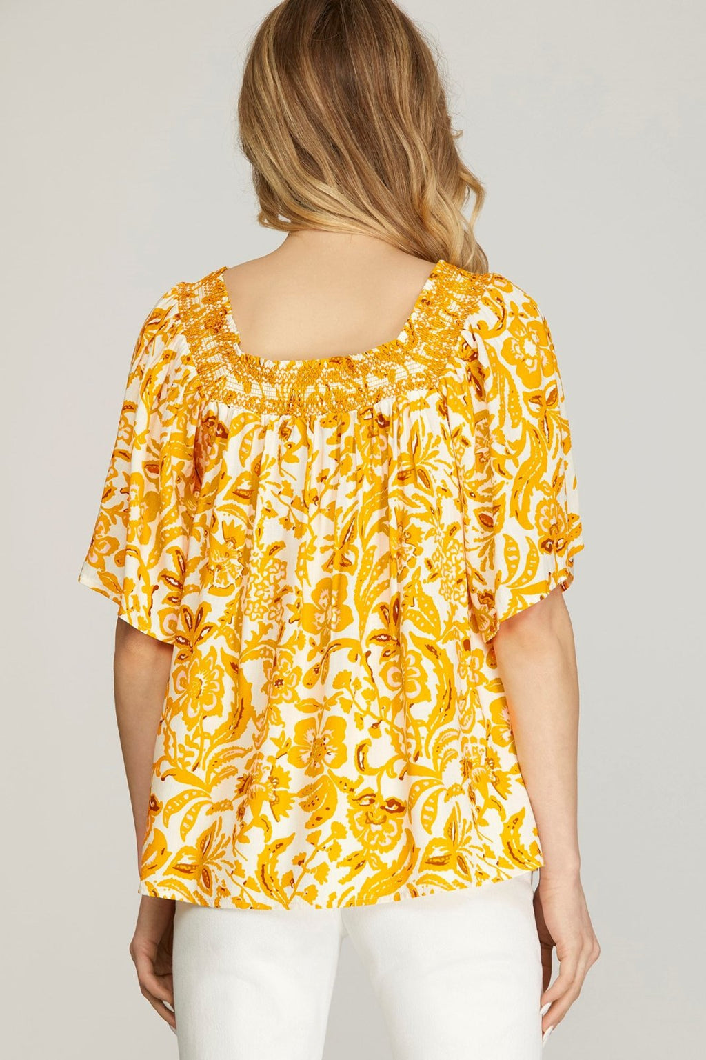 Yellow Print Smocked Top from Raggdoll Boutique, perfect for trendy coastal style and summer outfits in Texas.