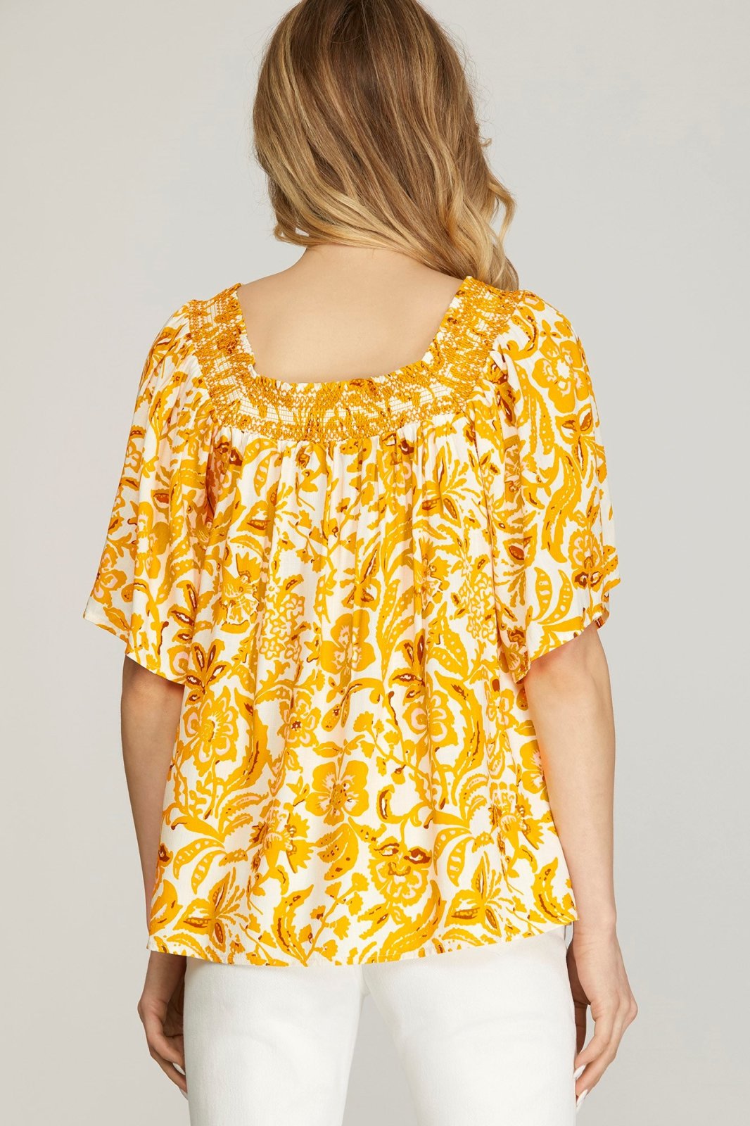 Sunflower Top from Raggdoll Boutique, a trendy coastal style women’s clothing for summer outfits in Port Aransas.