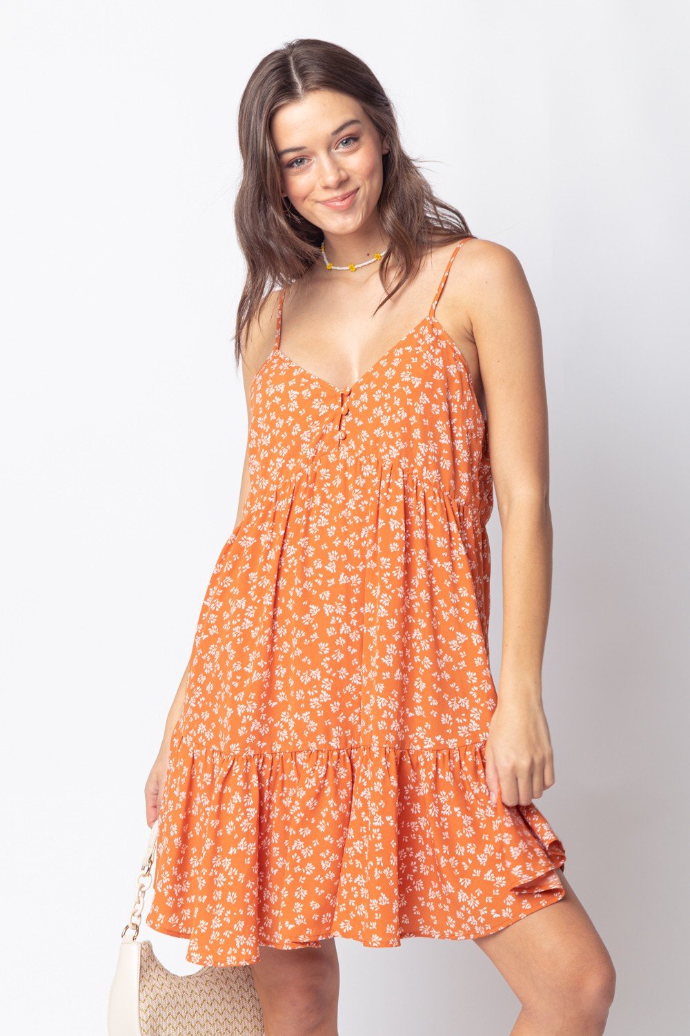 RUST SPAGHETTI STRAP DRESS model showcasing trendy coastal style from Raggdoll Boutique in Port Aransas.