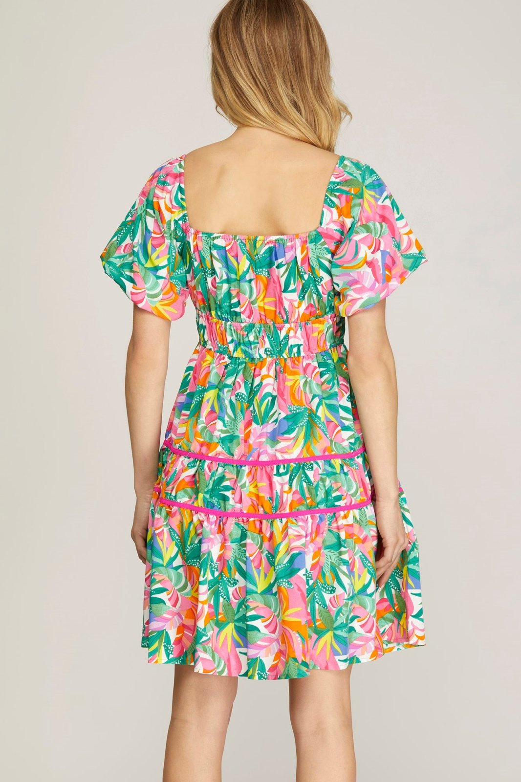 Spring Fling Dress showcasing vibrant tropical patterns, perfect for coastal fashion from Raggdoll Boutique.