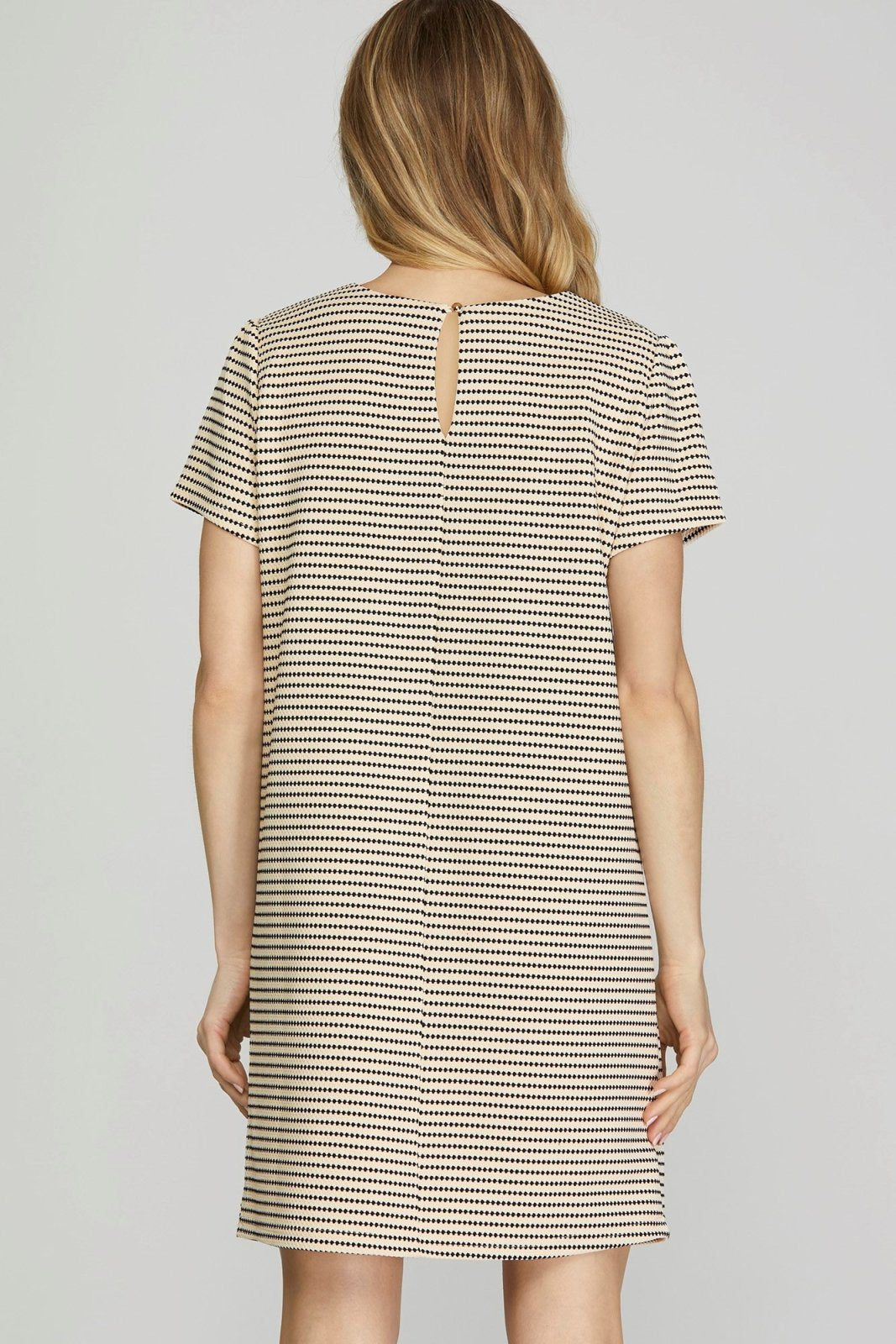 Back view of the Everly Dress from Raggdoll Boutique, ideal for trendy coastal style and summer outfits Texas.