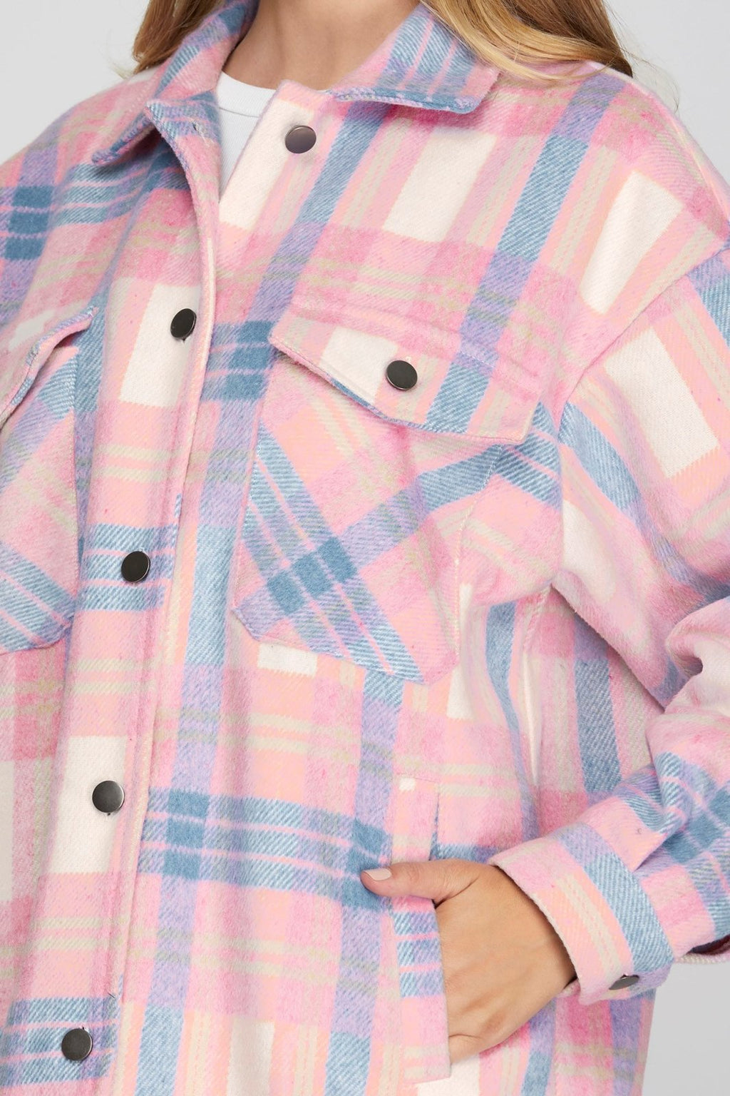 Stylish pink and blue plaid jacket from a coastal boutique, perfect for tropical vacations and curvy women's fashion.