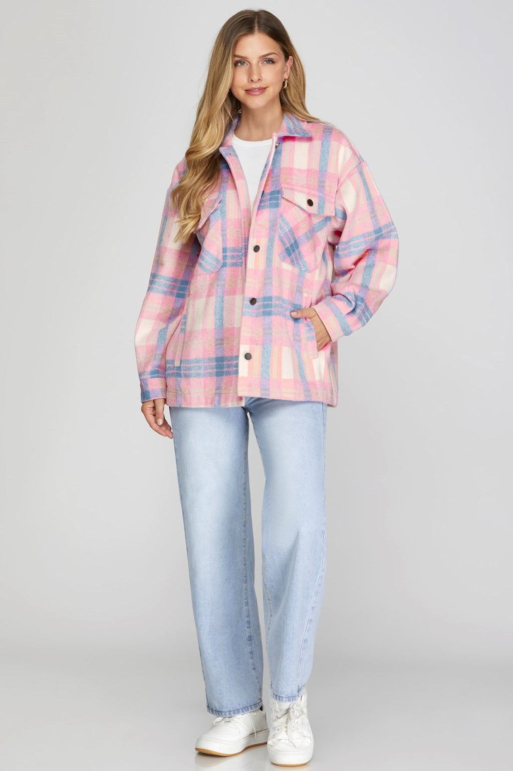 Trendy pink and blue plaid jacket, perfect for coastal boutique clothing in Port Aransas. Ideal for stylish women's fashion.