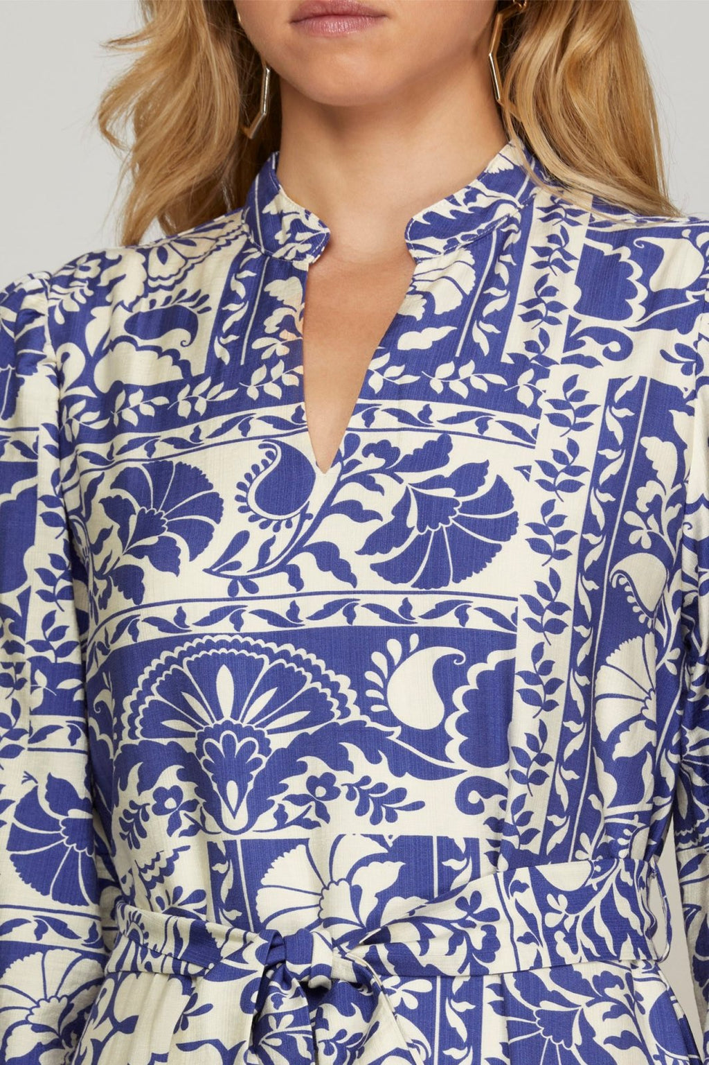 Stylish Britni dress featuring vibrant blue floral print, ideal for coastal boutique clothing and tropical vacations.