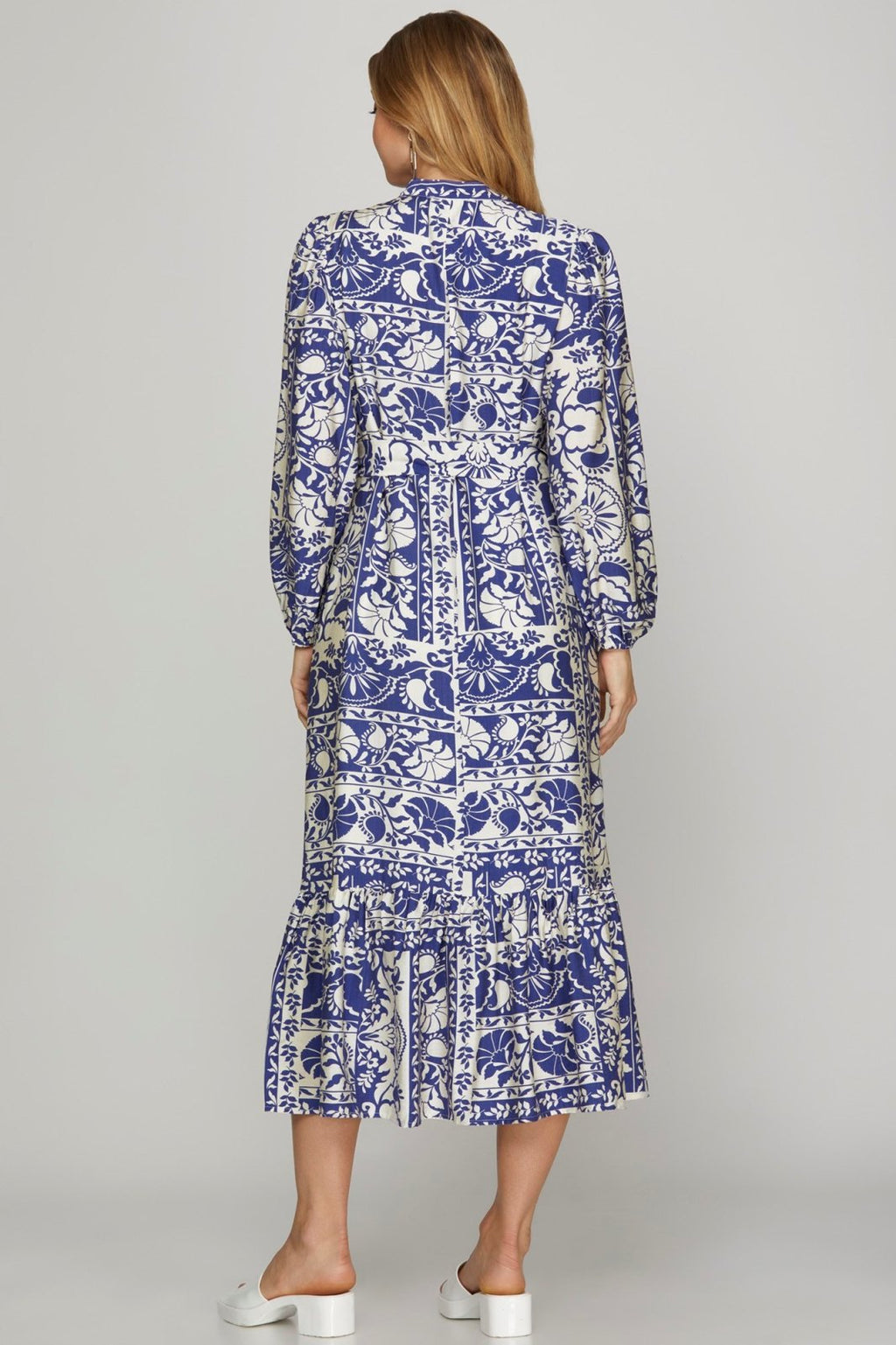 Stylish BRITNI DRESS in floral blue pattern, perfect for coastal boutique clothing and tropical vacation styles.