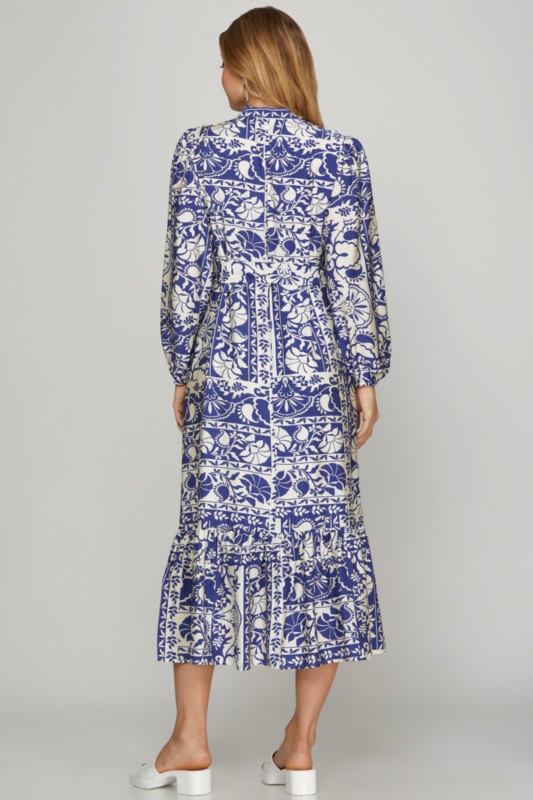 Stylish BRITNI DRESS in floral blue pattern, perfect for coastal boutique clothing and tropical vacation styles.