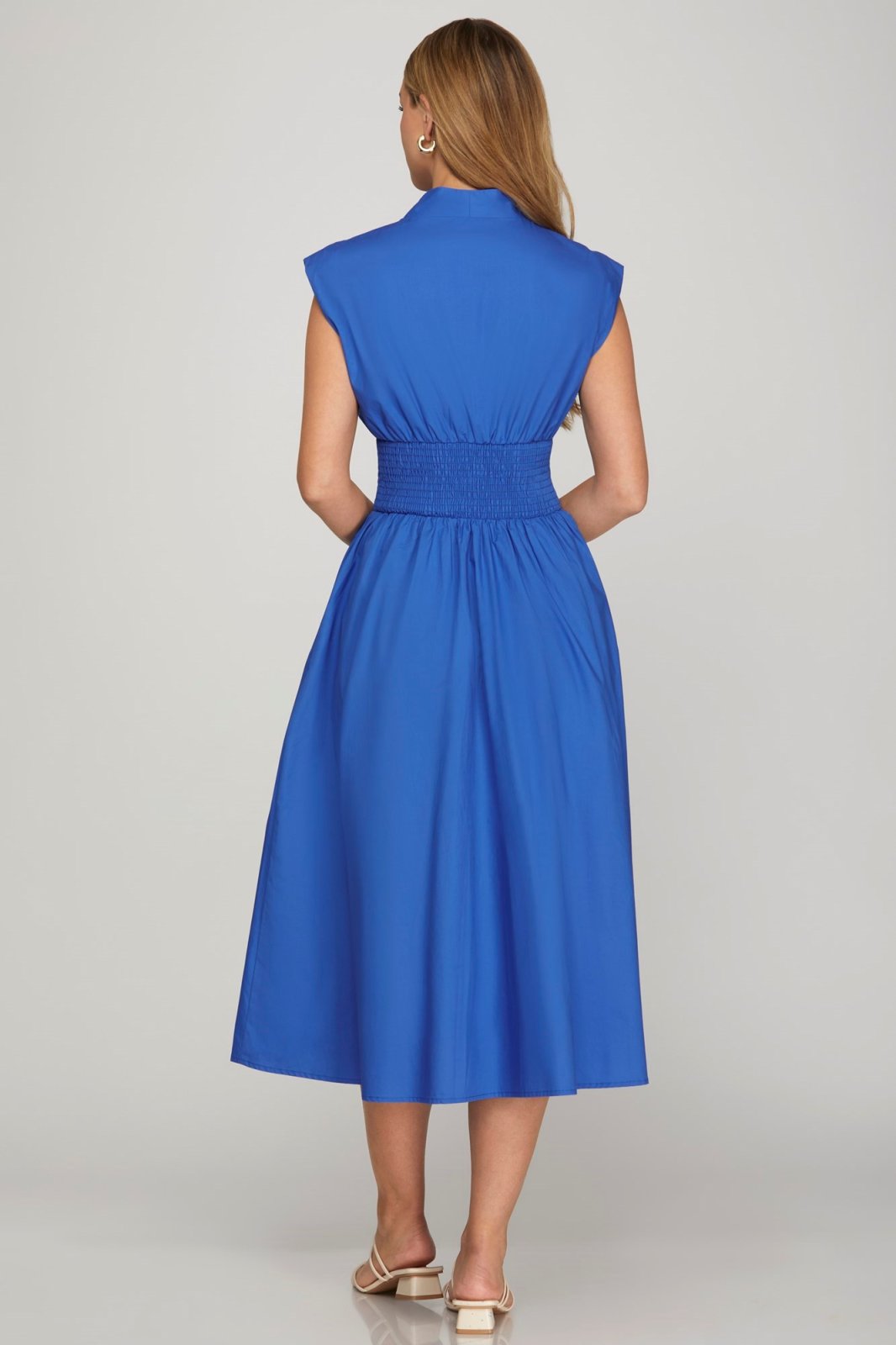 Royal Blue midi dress showcasing a smocked waist; perfect for coastal boutique clothing and stylish summer outfits.