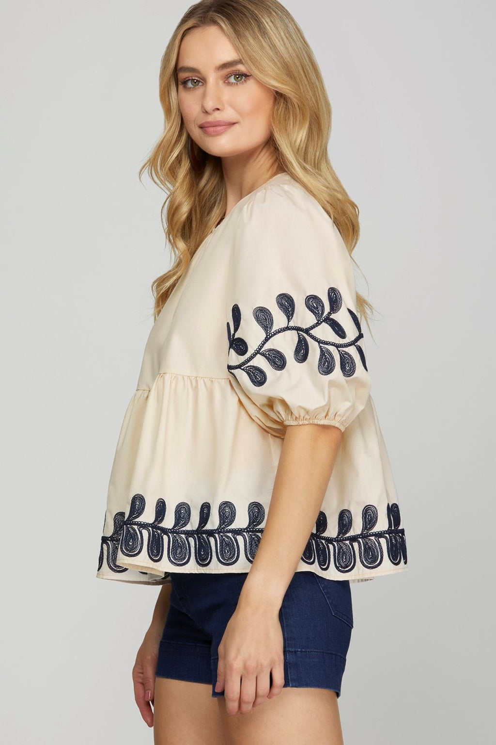 Embroidered light taupe top from a coastal boutique, perfect for tropical vacations and stylish women's fashion.